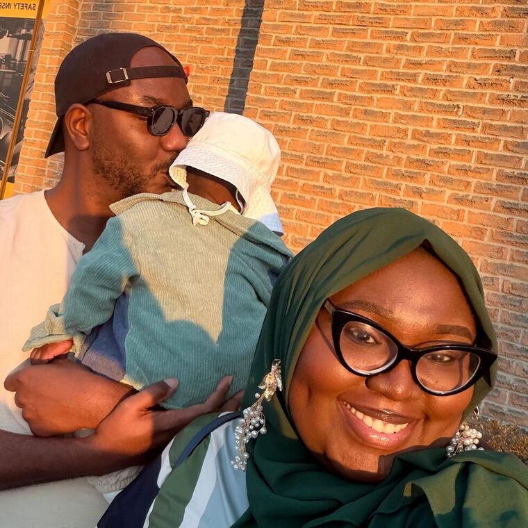 Tolut Bako with his wife and their baby son